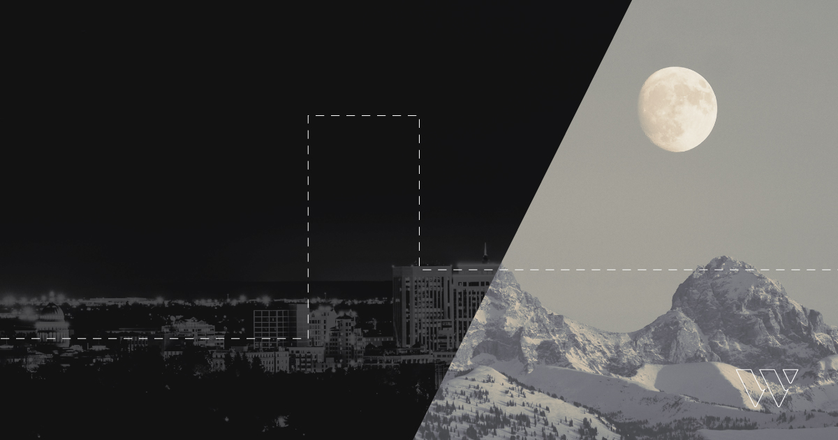 Rectangular image split a little to the right of the center by a diagonal line. Left side of the frame is black with a city scape present. Right side of the image is gray with a mountain visible.