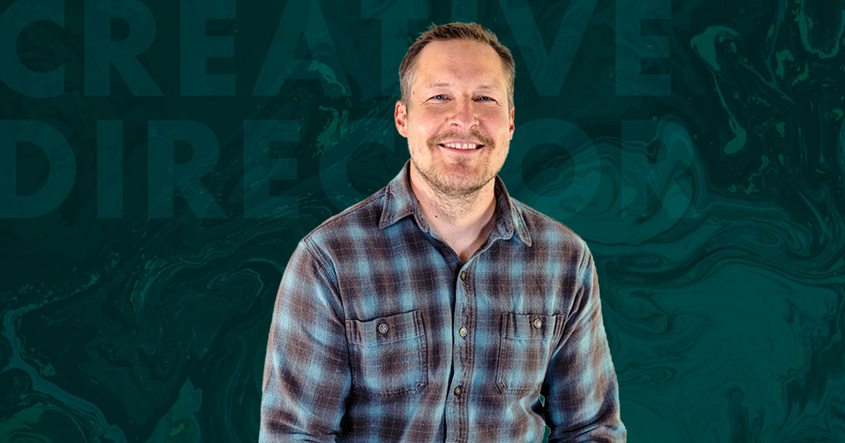Rectangular image. Photo of Kelly Knopp at the center. Swirly green texture background behind him. Subtle, lighter green copy that reads "CREATIVE DIRECTOR" is at the top left of the frame.